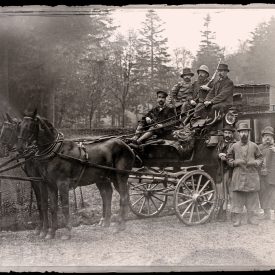 Return with the Stag: The party crowds a four‑wheeled brake with trophy and pinfires.